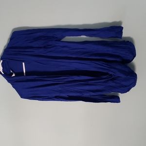 Like new. Open cardigan with knot at bottom.